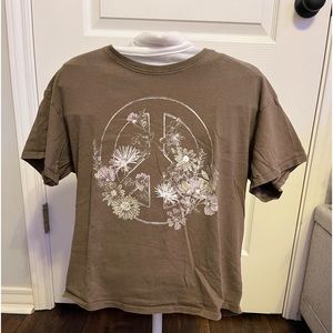 This is a kids grunge T shirt it is the brand Art Class and a dark tan color
